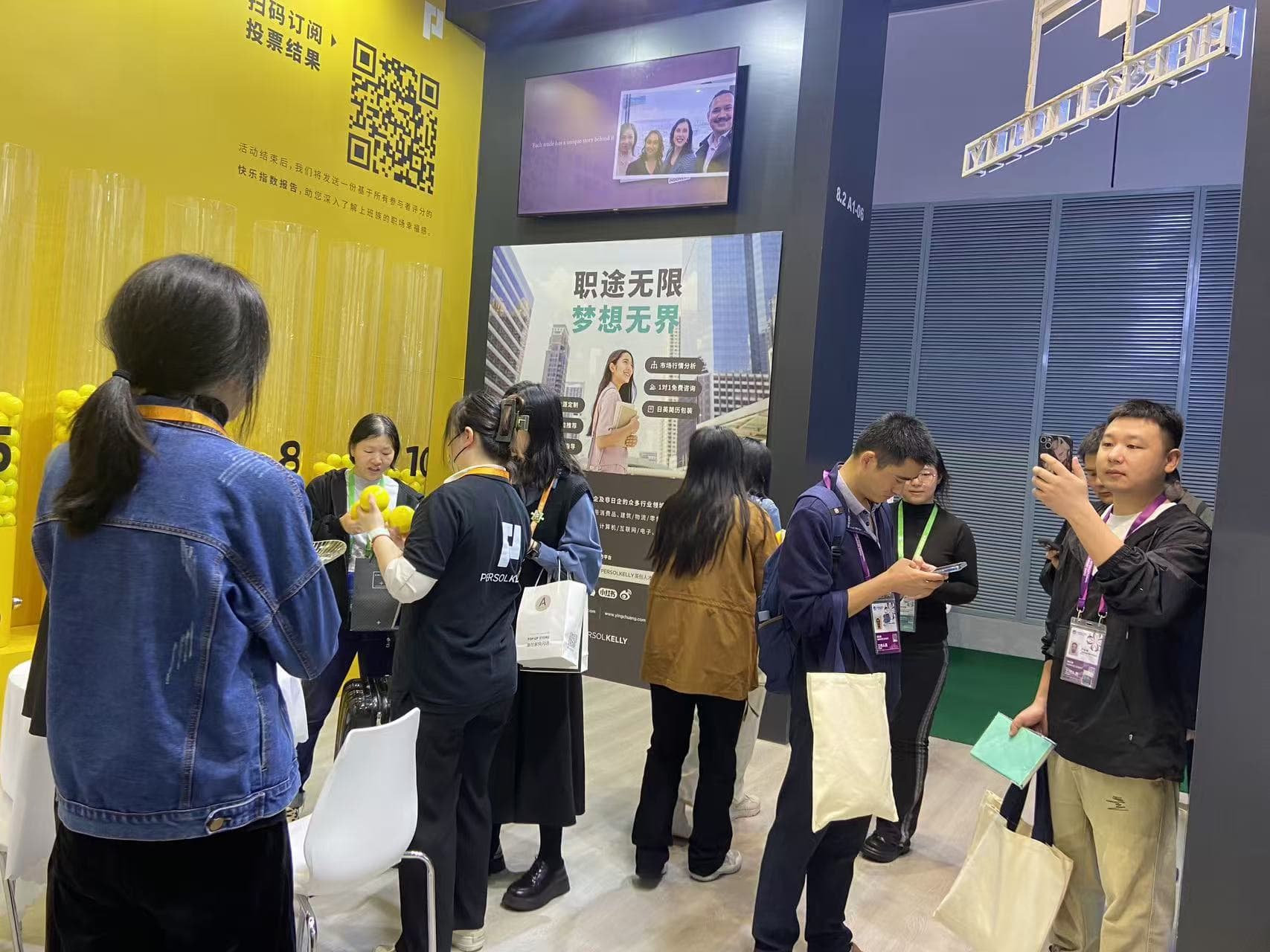 PERSOL team speaking with exhibition visitors